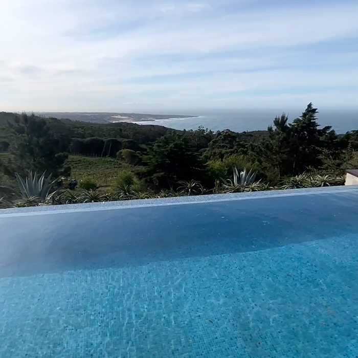 Infinity pool overlooking the green landscape near the Silver Coast