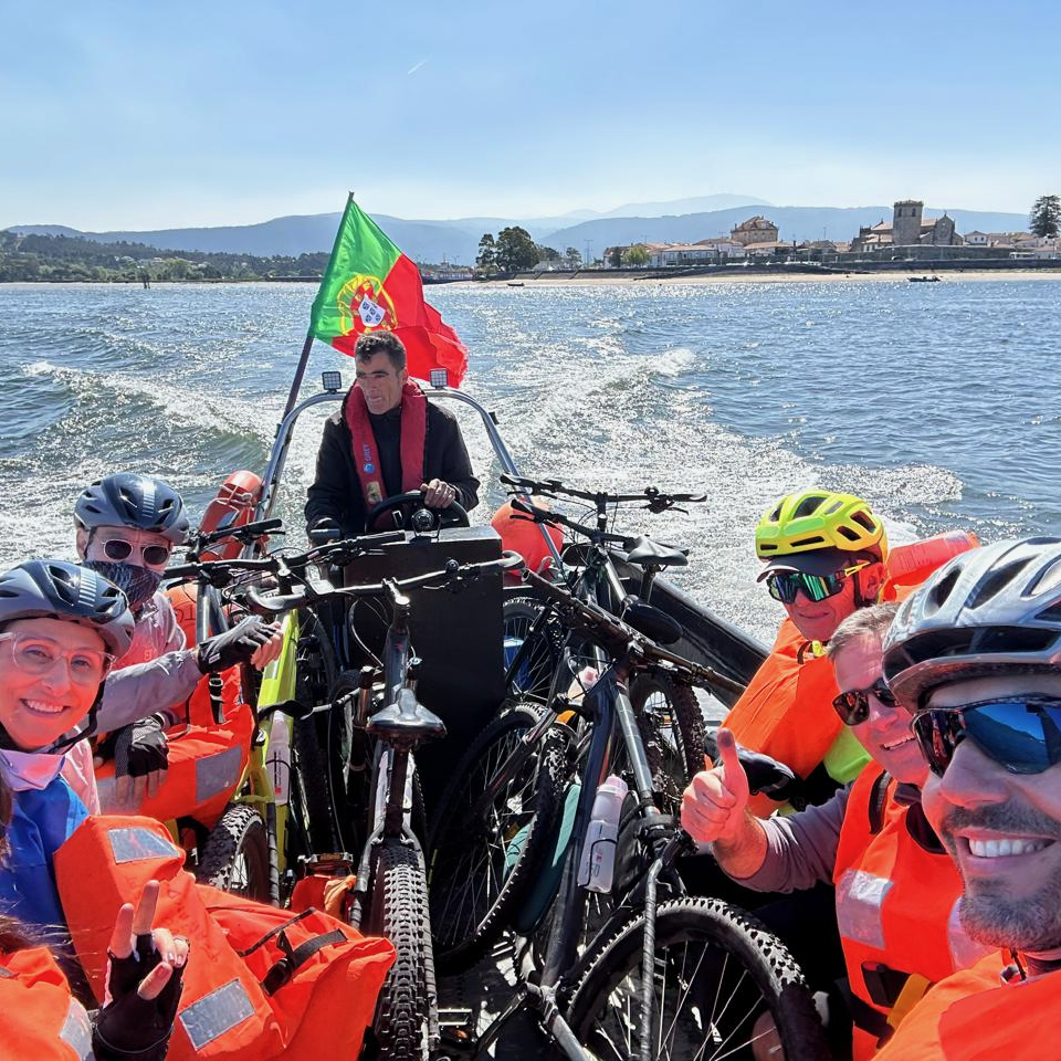 Cycling group and their bikes crossing the estuary by boat