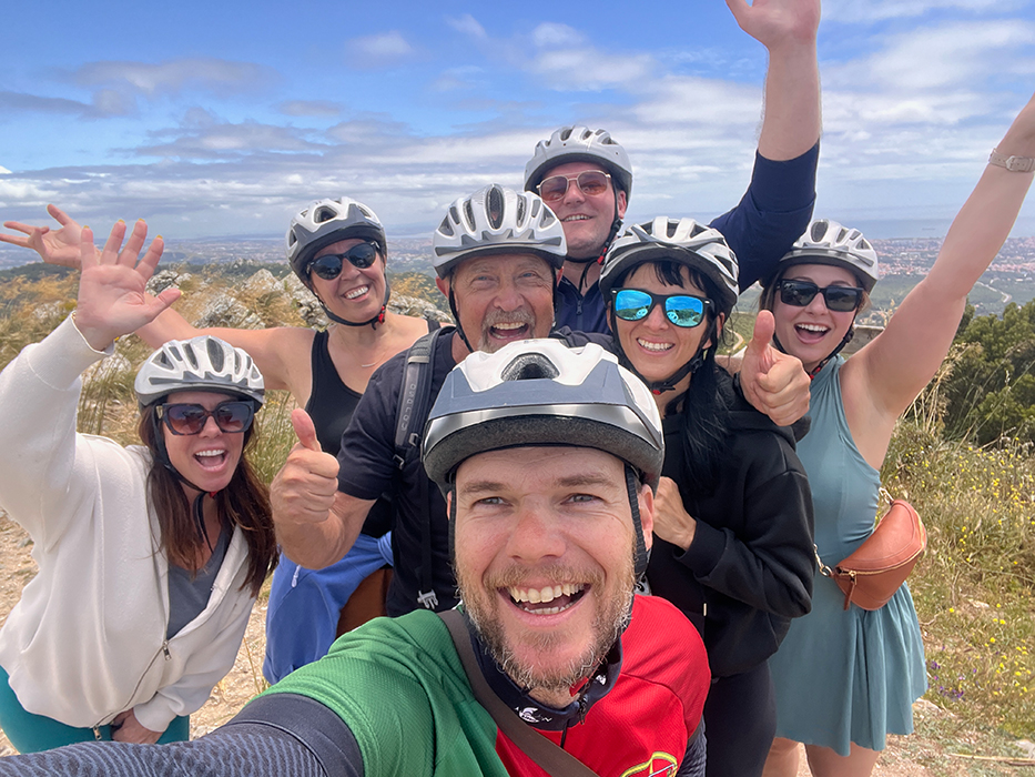 Happy cyclists smiling on a Somewherein.pt tour