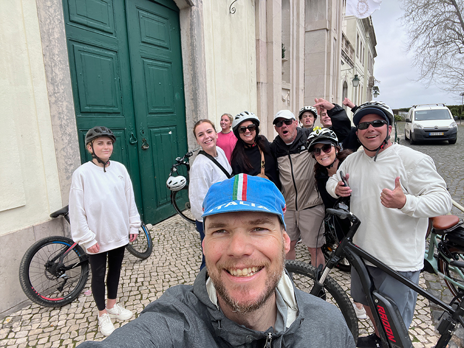Happy cyclists smiling on a Somewherein.pt tour