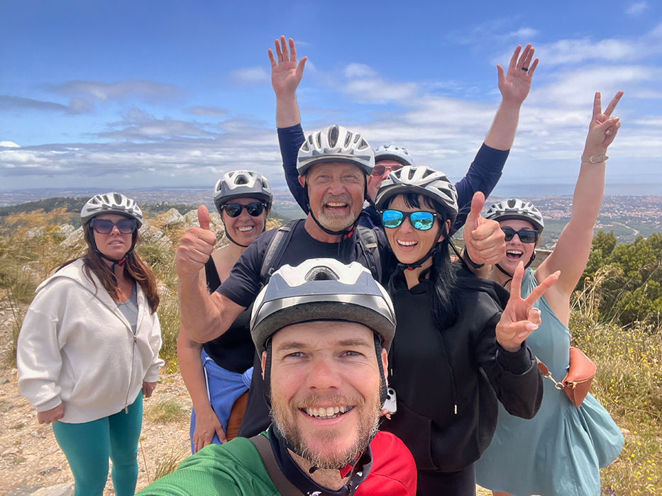 Happy cyclists smiling on a Somewherein.pt tour